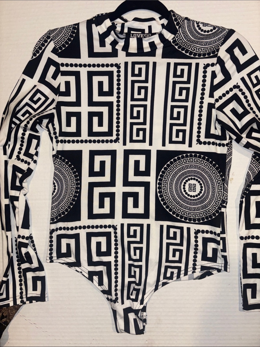 LOVE 83 BRAND 
BLACK AND WHITE BODY SUIT GEOMETRIC DESIGN
LONG SLEEVES